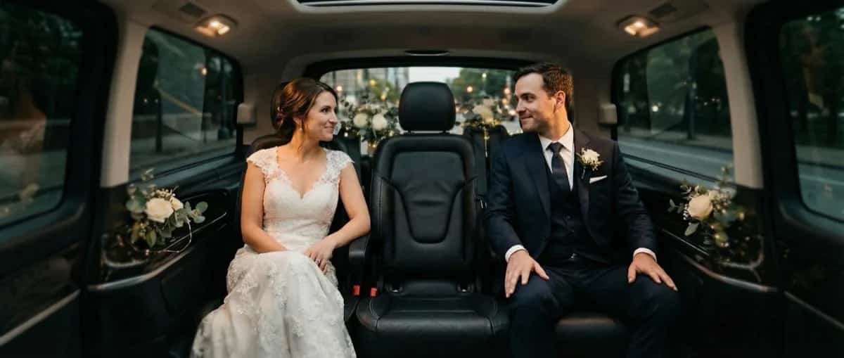 Elegant couple in luxury Mercedes van for wedding and event private transport in Paris